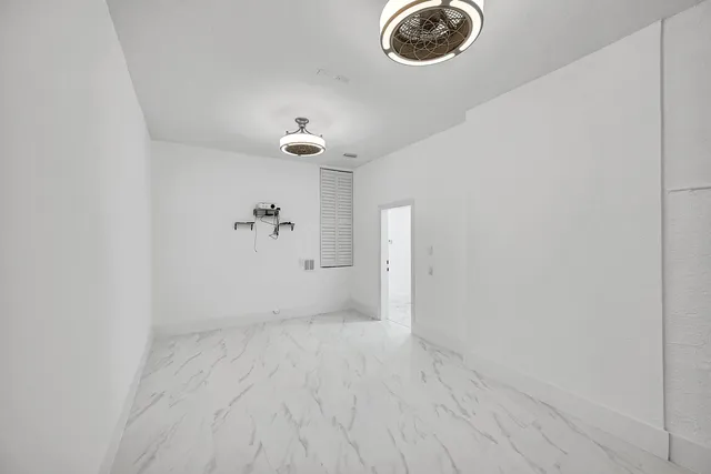 a view of entryway with wooden floor and stairs