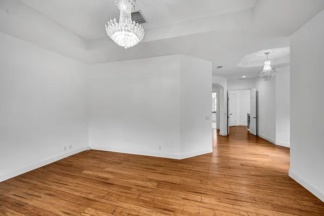 a view of a street with a building in the background