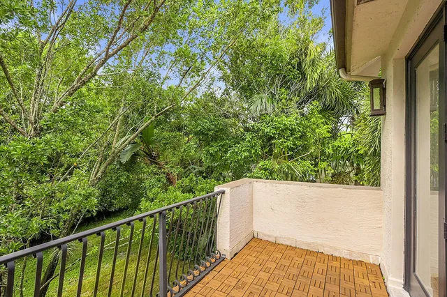 view of a house with a yard and sitting area