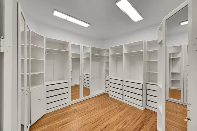 an aerial view of a house with a yard and potted plants