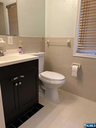 a bathroom with a sink toilet and vanity