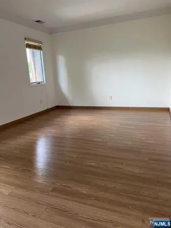 a view of room and wooden floor