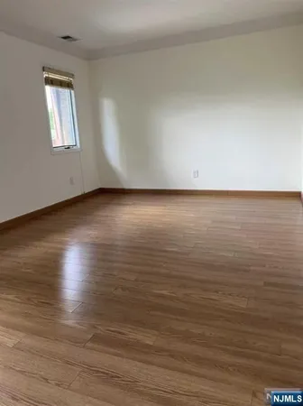 a view of room and wooden floor
