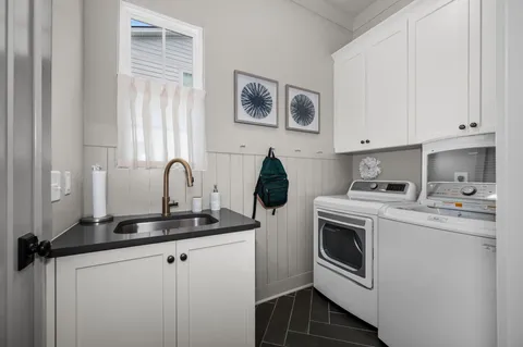 a kitchen with a sink and cabinets