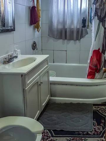 a bathroom with a sink and toilet
