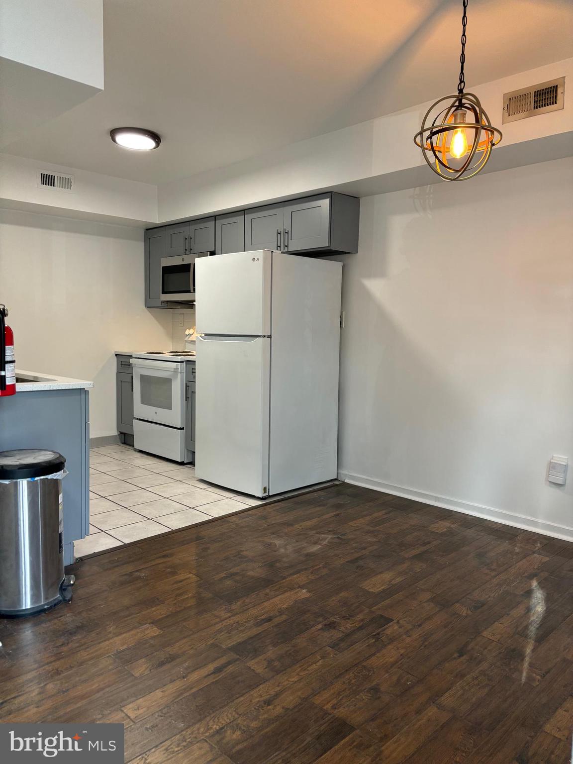 101 Gregorys Way Voorhees, NJ 08043 - Photo 6 of 16 a view of kitchen with furniture and wooden floor