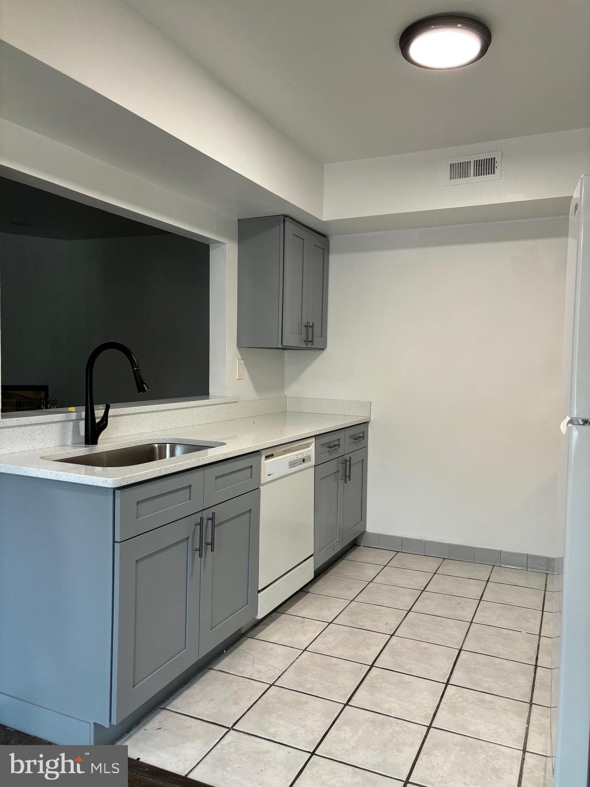 101 Gregorys Way Voorhees, NJ 08043 - Photo 7 of 16 a kitchen with a sink and cabinets