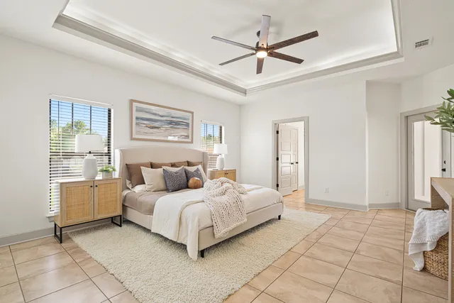a spacious bathroom with a granite countertop sink a toilet and shower