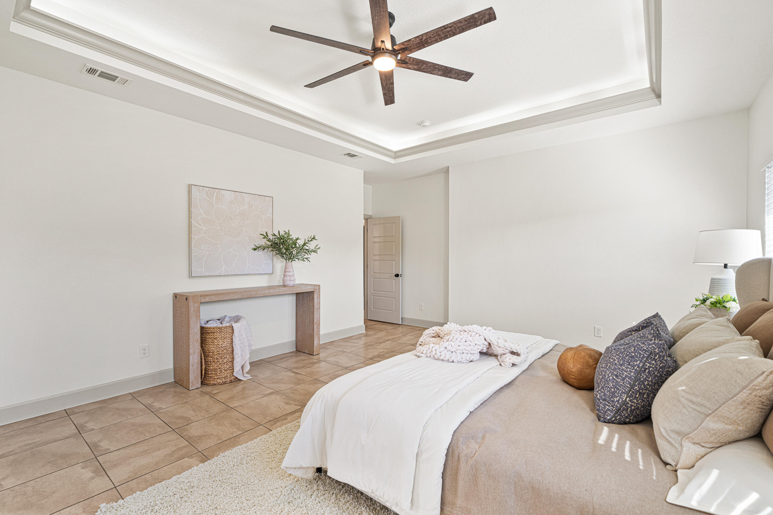 6301 Antigone Circle Crestview, FL 32536 - Photo 27 of 82 a bedroom with a bed and a chandelier