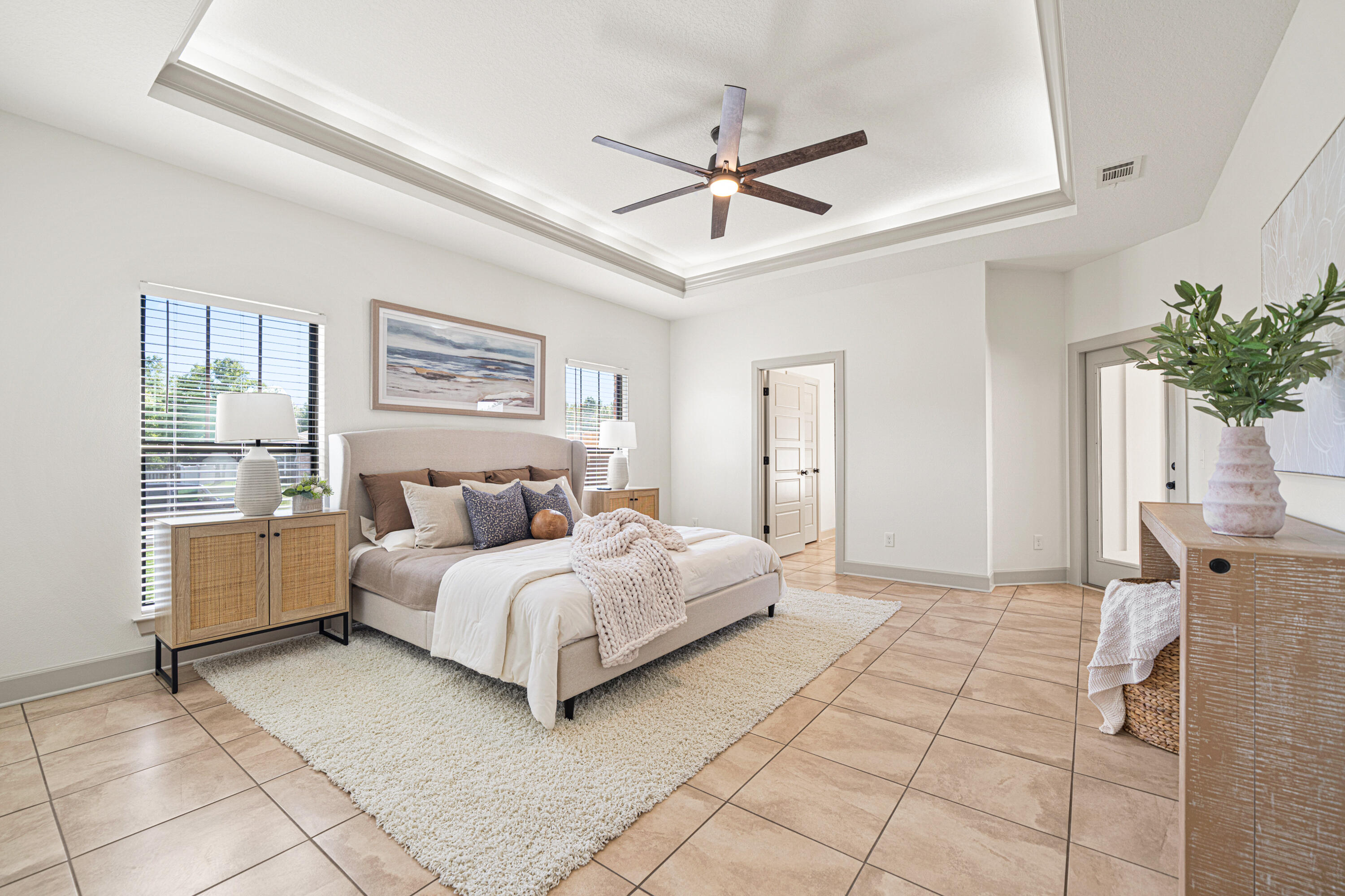 6301 Antigone Circle Crestview, FL 32536 - Photo 29 of 82 a spacious bedroom with a bed and a chandelier