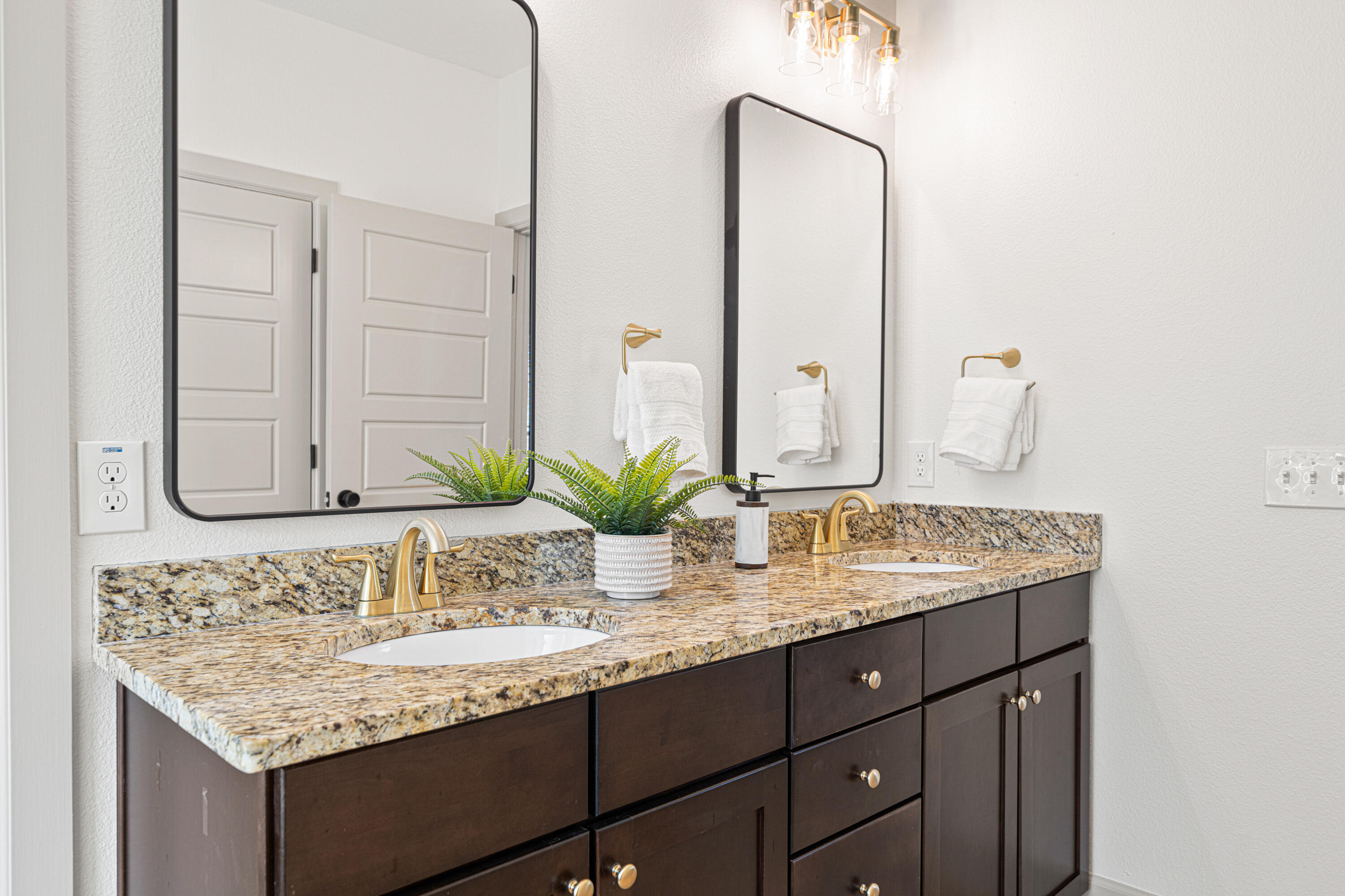 6301 Antigone Circle Crestview, FL 32536 - Photo 32 of 82 a bathroom with a granite countertop sink and a mirror