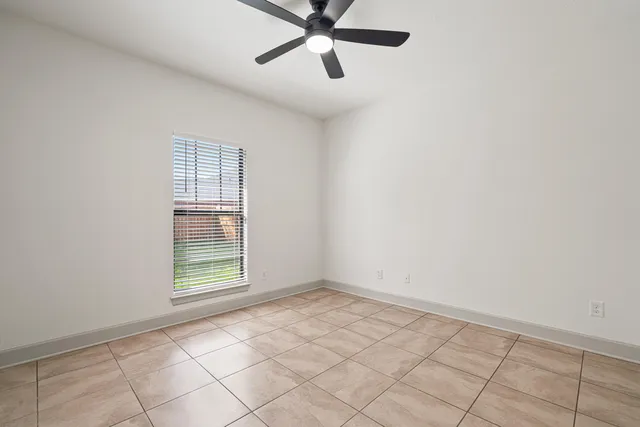 a white toilet sitting next to a bath tub