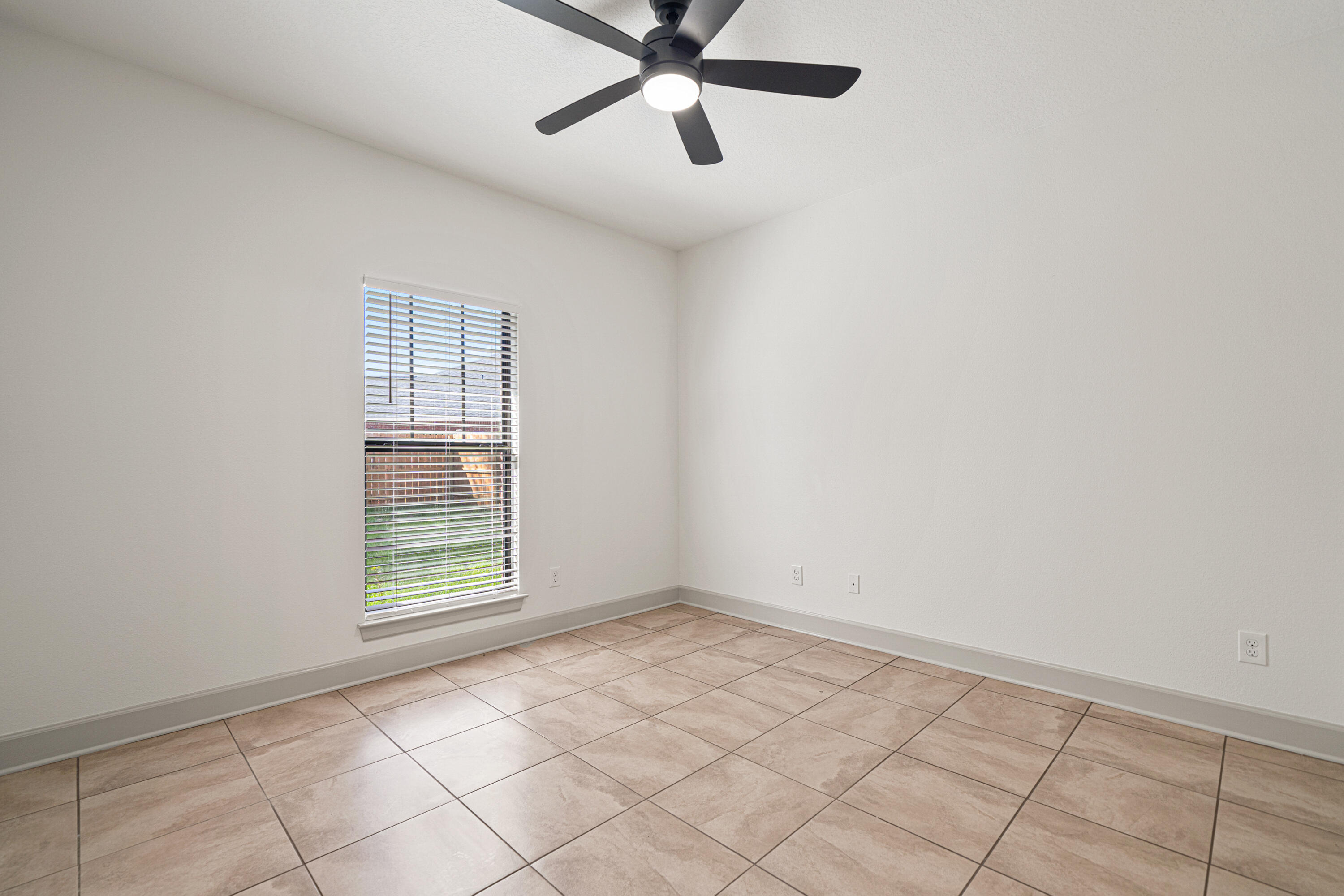 6301 Antigone Circle Crestview, FL 32536 - Photo 40 of 82 an empty room with windows and fan