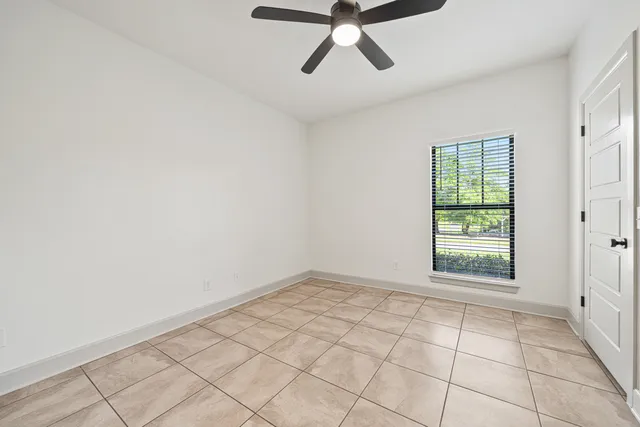 a view of a house with a backyard and a tree