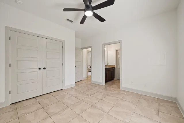 a view of a house with backyard and trees