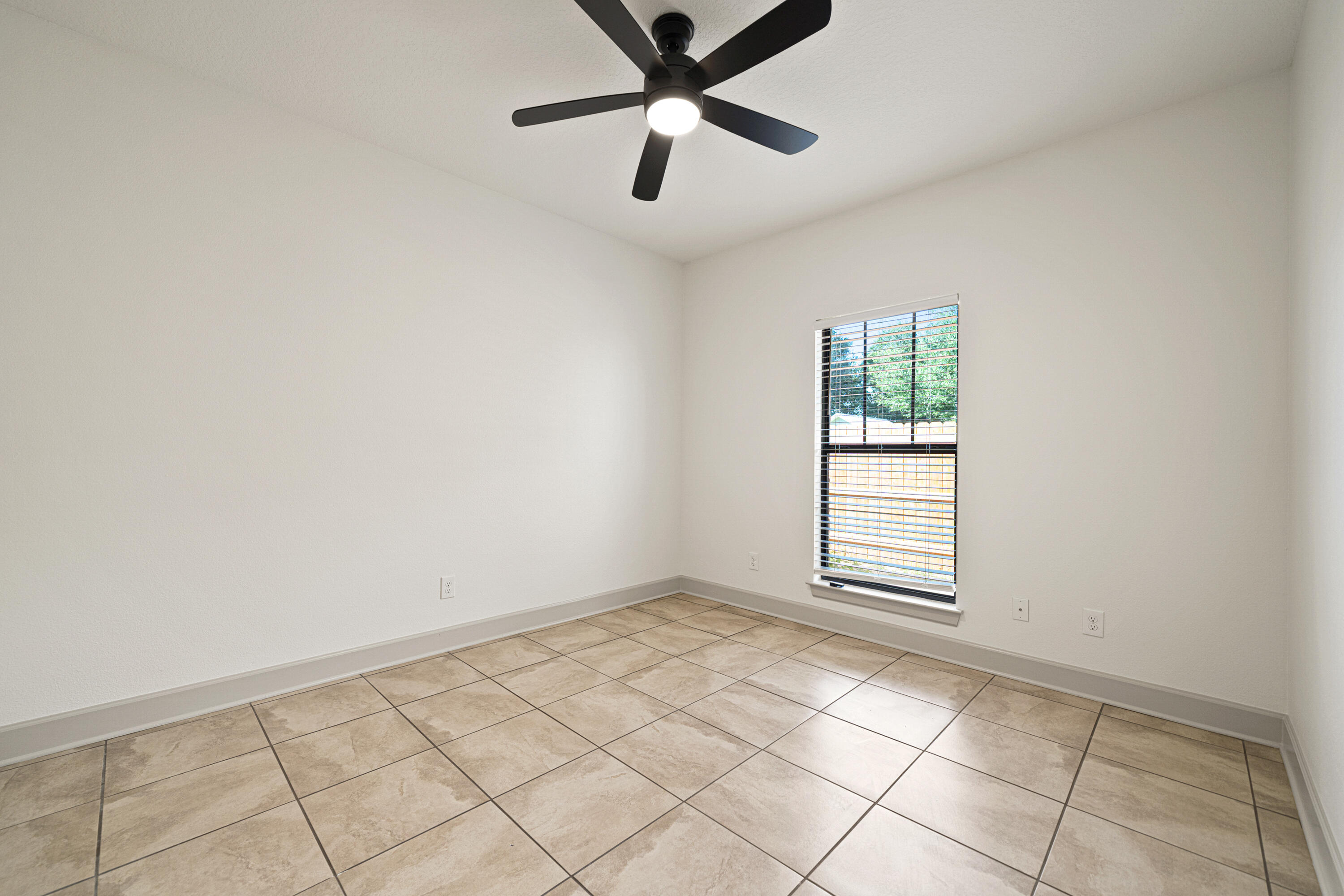 6301 Antigone Circle Crestview, FL 32536 - Photo 47 of 82 an empty room with windows and fan