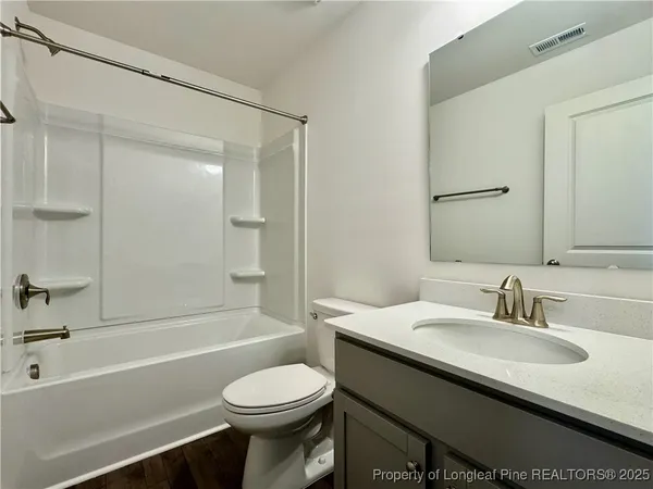 a bathroom with a sink a toilet and a bathtub