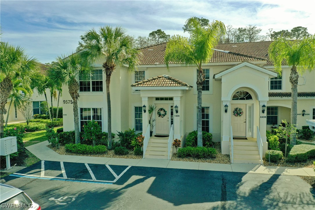 9575 Hemingway Lane, Unit 4410 Fort Myers, FL 33913 - Photo 1 of 23 a front view of a house with garden