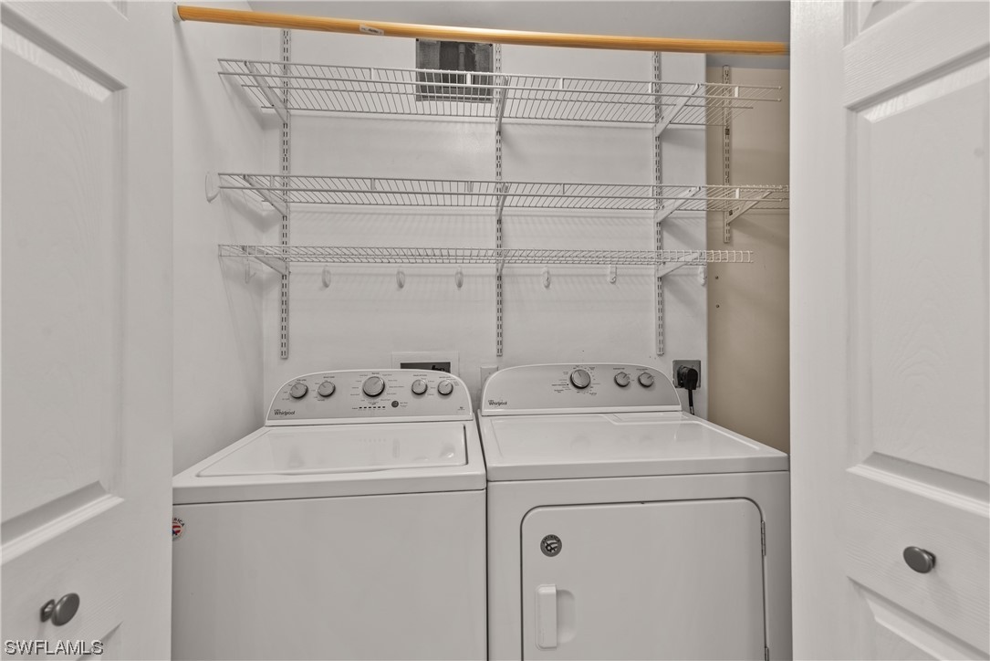 9575 Hemingway Lane, Unit 4410 Fort Myers, FL 33913 - Photo 13 of 23 a utility room with dryer and washer