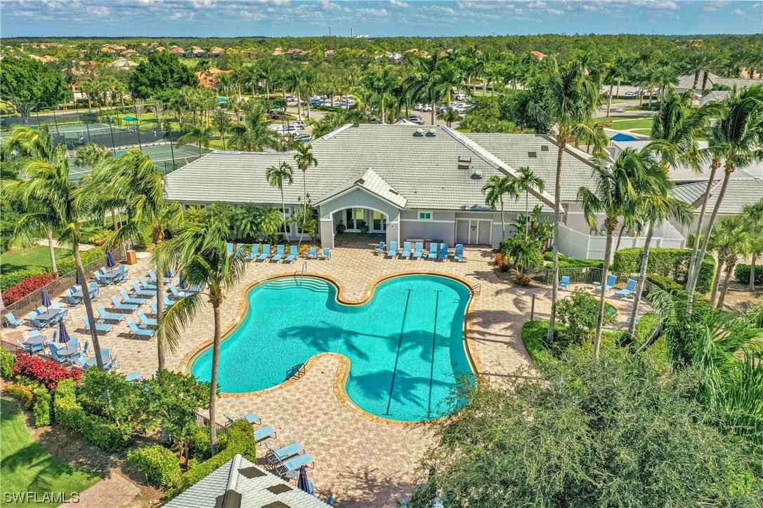 9575 Hemingway Lane, Unit 4410 Fort Myers, FL 33913 - Photo 19 of 23 a view of a house with a backyard and a patio
