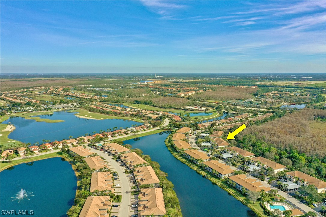 9575 Hemingway Lane, Unit 4410 Fort Myers, FL 33913 - Photo 3 of 23 an aerial view of ocean and residential houses with outdoor space