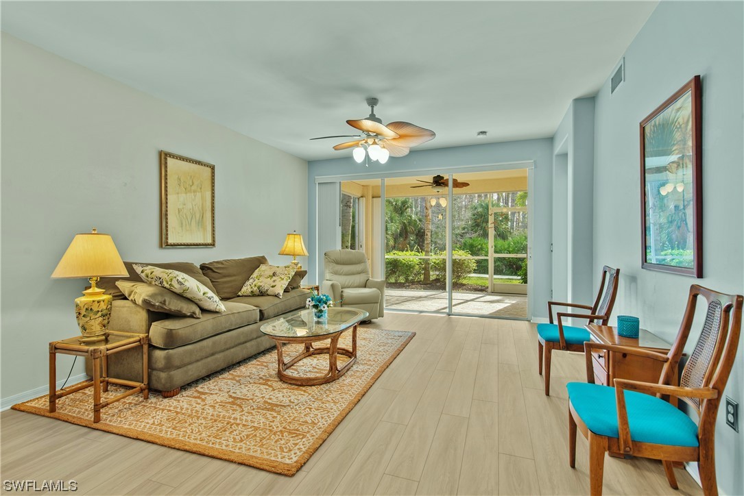 9575 Hemingway Lane, Unit 4410 Fort Myers, FL 33913 - Photo 5 of 23 a living room with furniture and a large window
