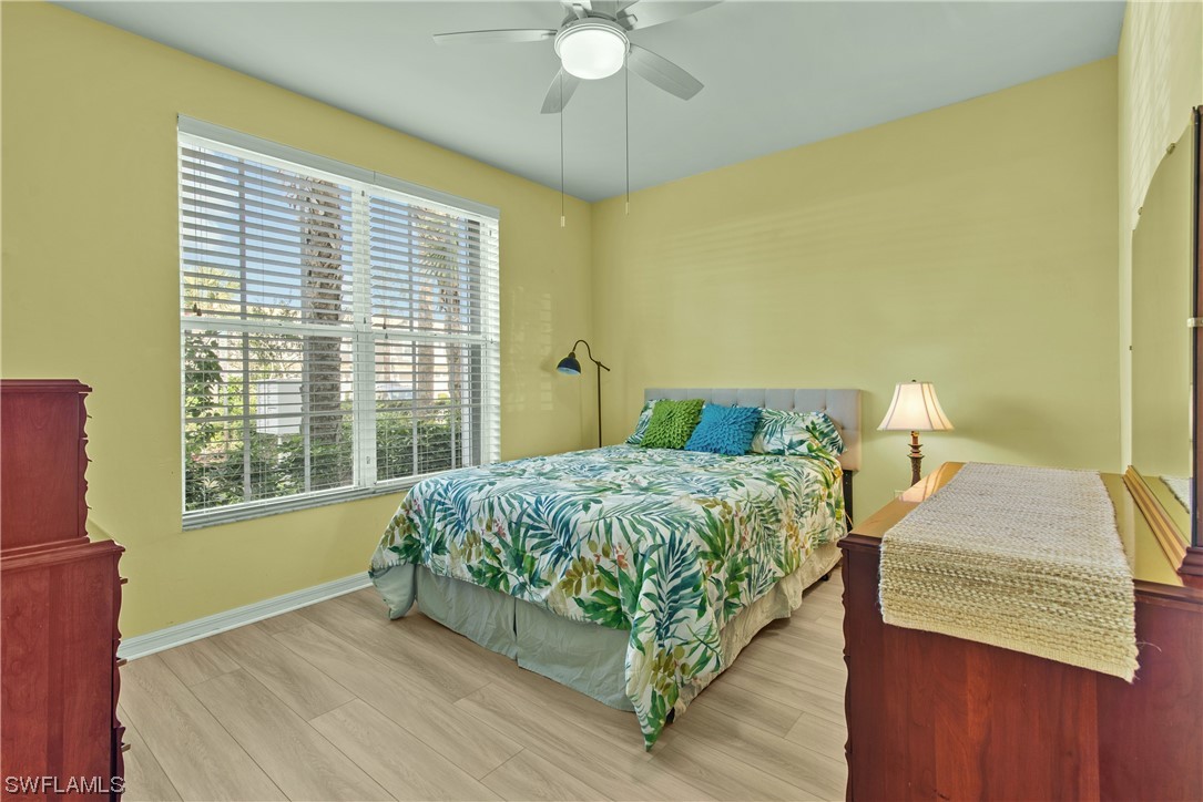 9575 Hemingway Lane, Unit 4410 Fort Myers, FL 33913 - Photo 10 of 23 a bedroom with a bed and window