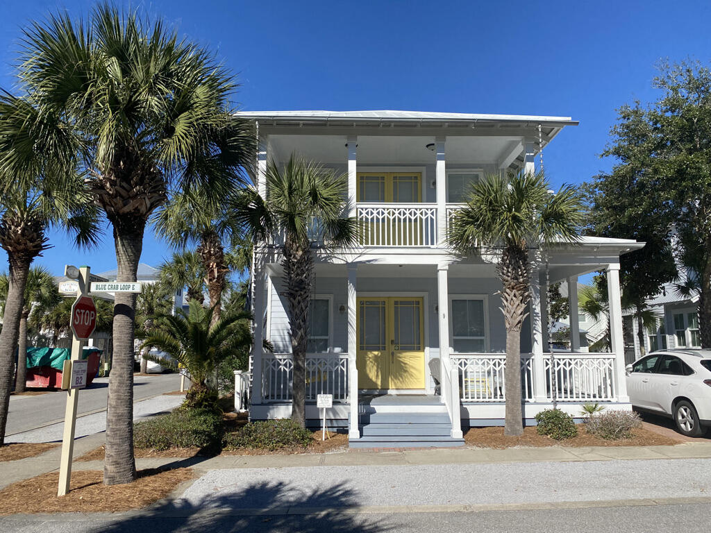 a view of a building with palm trees