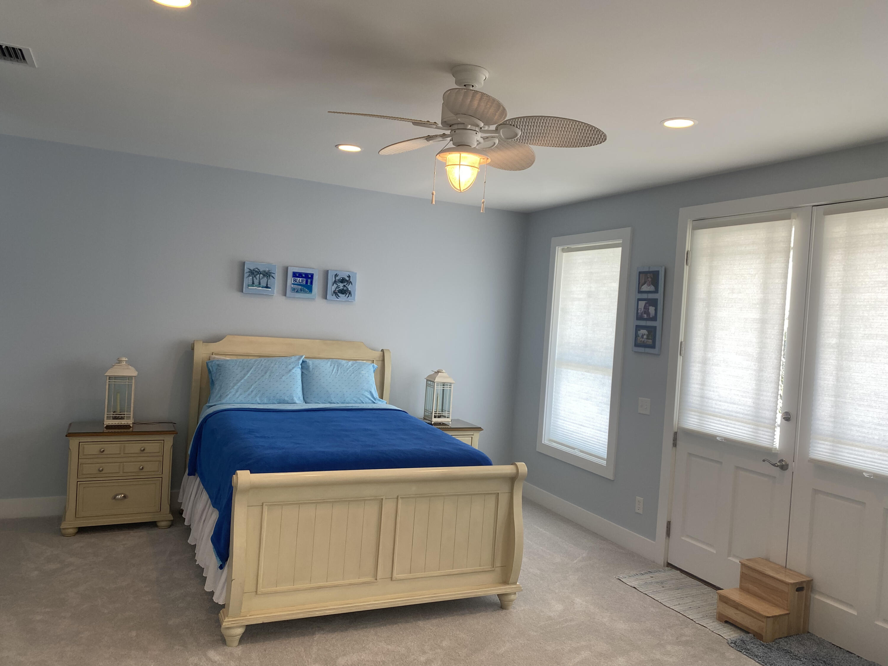 9 East Blue Crab Loop Inlet Beach, FL 32461 - Photo 15 of 55 a bedroom with a bed and a chandelier