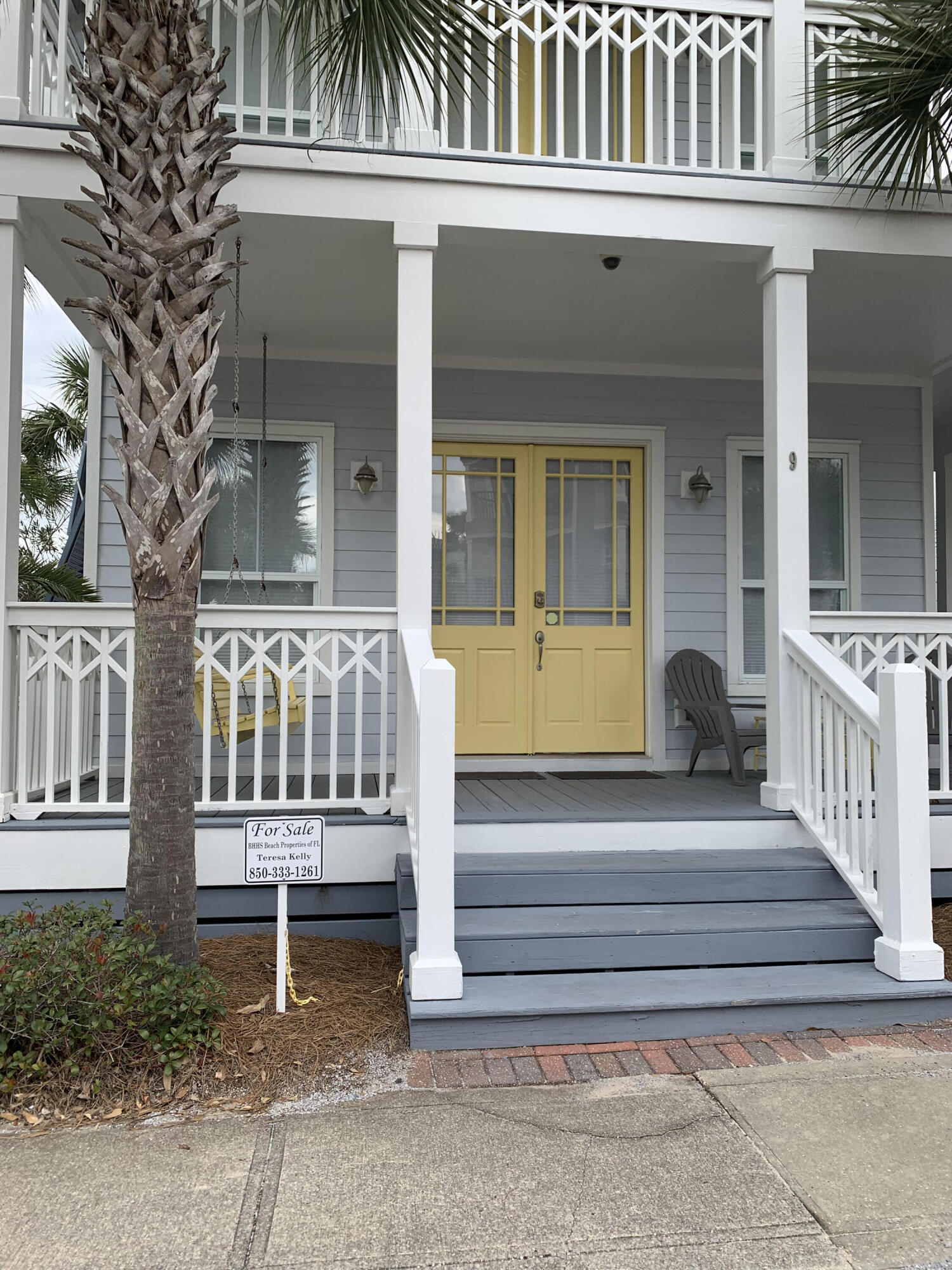 9 East Blue Crab Loop Inlet Beach, FL 32461 - Photo 2 of 55 a view of a house with a small yard and wooden fence and a porch