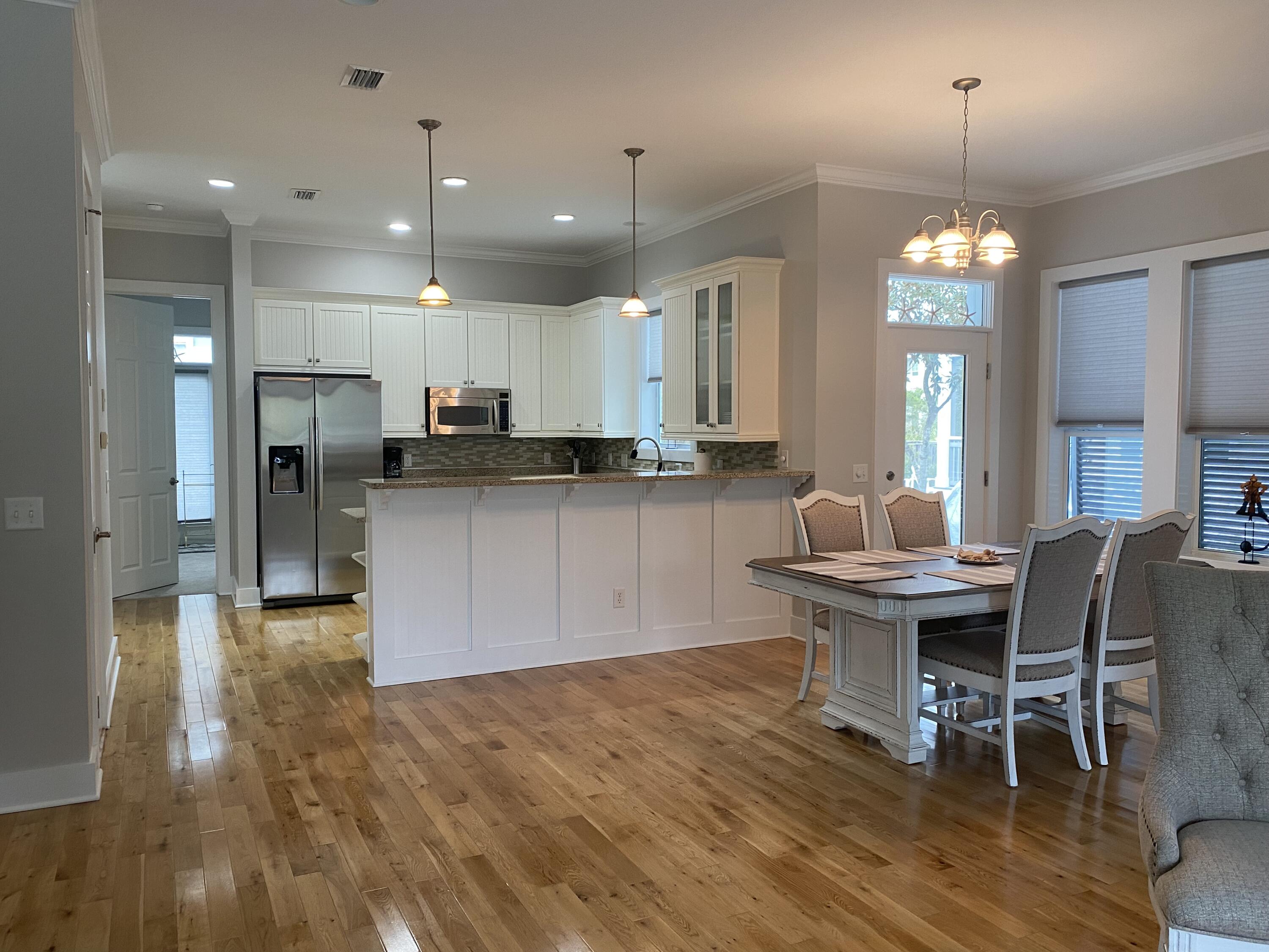 9 East Blue Crab Loop Inlet Beach, FL 32461 - Photo 3 of 55 a kitchen and a refrigerator in a room