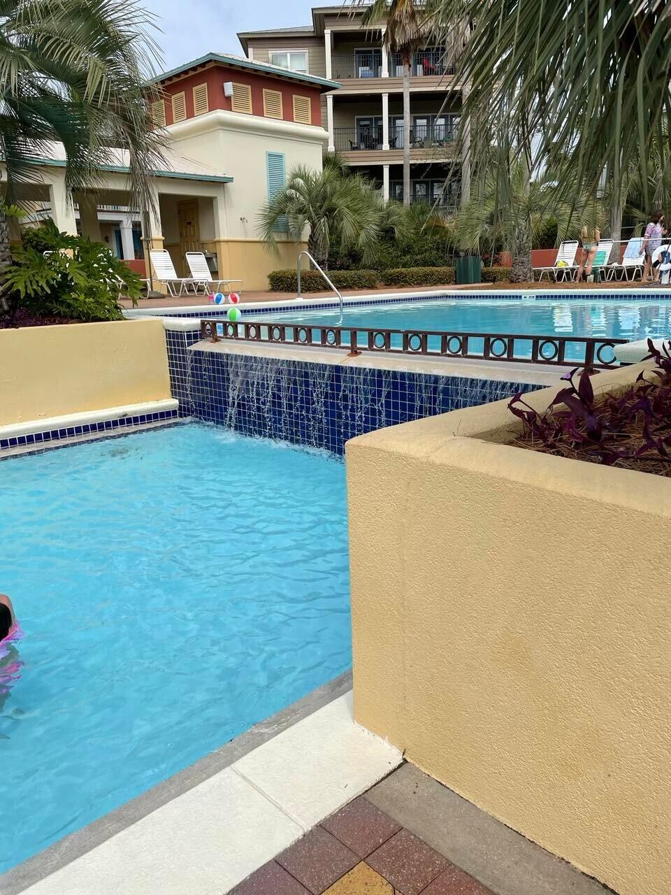 9 East Blue Crab Loop Inlet Beach, FL 32461 - Photo 50 of 55 a view of a house with a swimming pool
