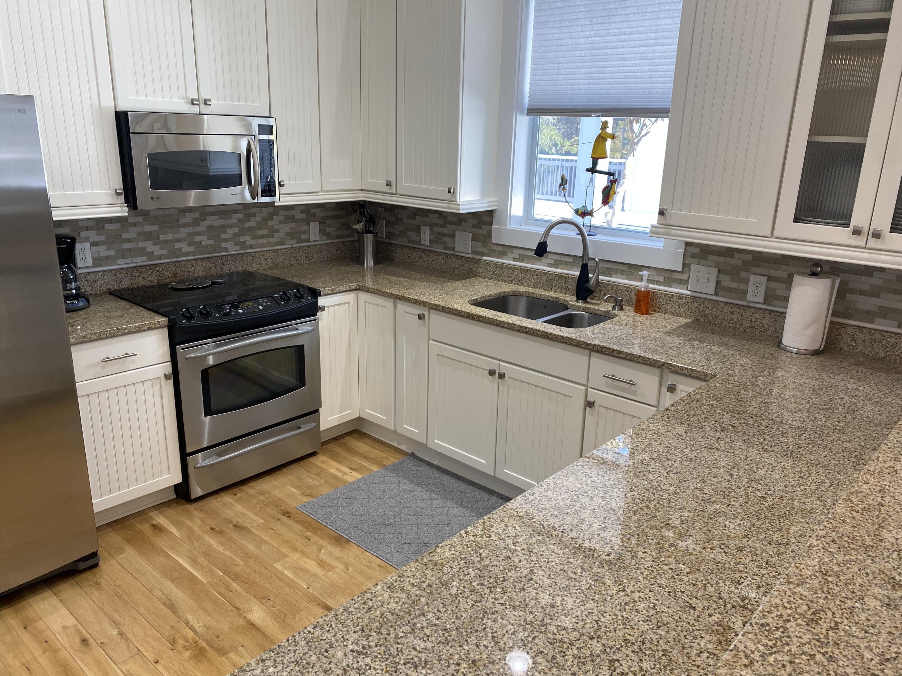 9 East Blue Crab Loop Inlet Beach, FL 32461 - Photo 9 of 55 a kitchen with stainless steel appliances granite countertop a sink stove and cabinets