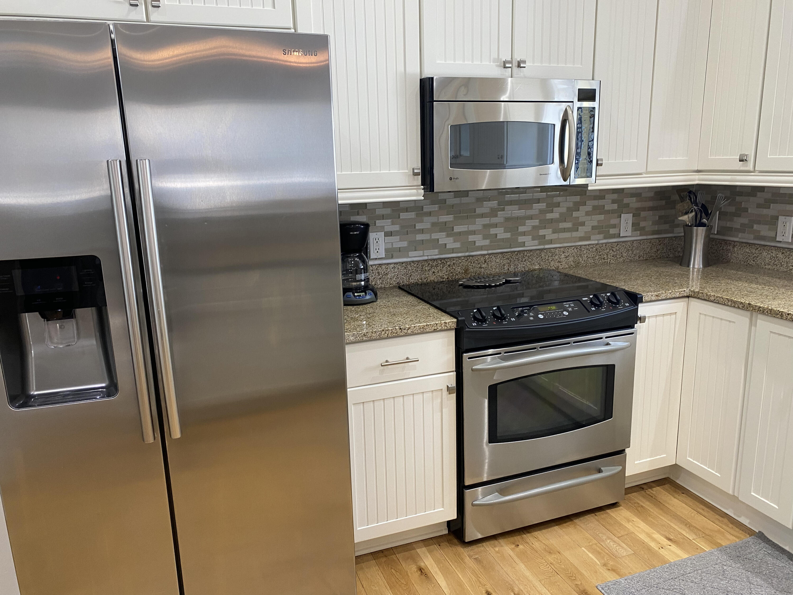 9 East Blue Crab Loop Inlet Beach, FL 32461 - Photo 10 of 55 a kitchen with cabinets and stainless steel appliances