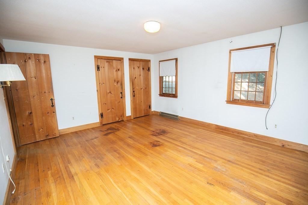 35 Juggler Meadow Road Leverett, MA 01054 - Photo 24 of 40 a view of an empty room with wooden floor and a window