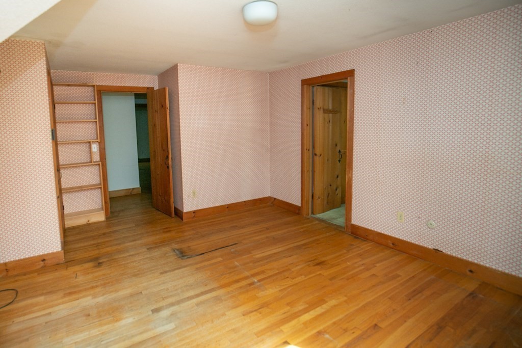 35 Juggler Meadow Road Leverett, MA 01054 - Photo 25 of 40 a view of an empty room with wooden floor and closet