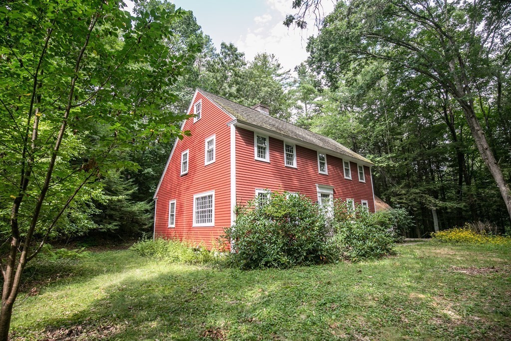 35 Juggler Meadow Road Leverett, MA 01054 - Photo 38 of 40 a view of a brick house with a yard