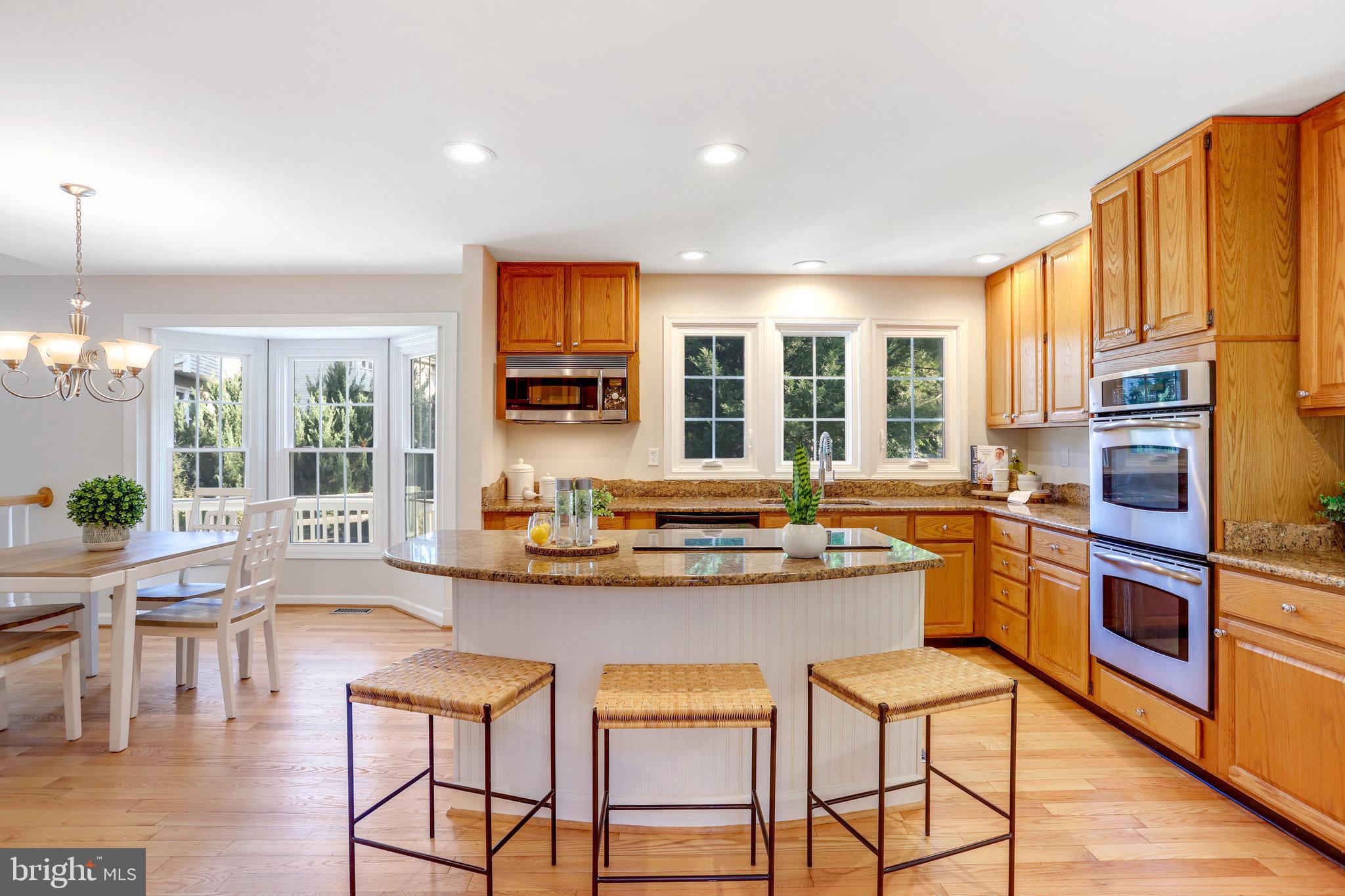 6121 Cool Spring Terrace North Frederick, MD 21701 - Photo 11 of 53 open kitchen with wood floor