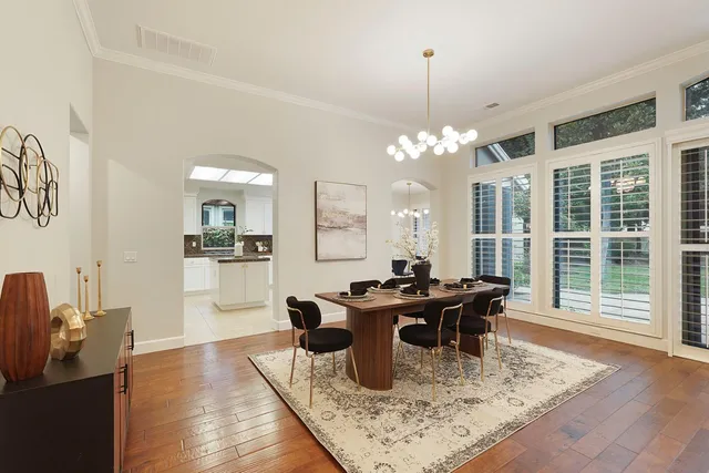a kitchen with stainless steel appliances granite countertop a sink refrigerator and cabinets