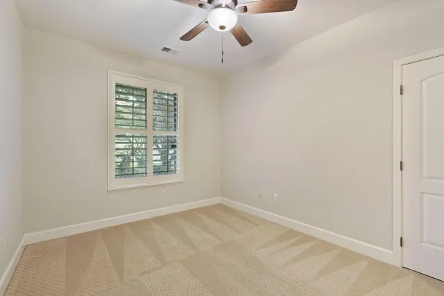 a house that has a tree in front of it