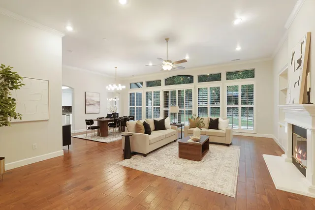 a living room with furniture a window and a fireplace