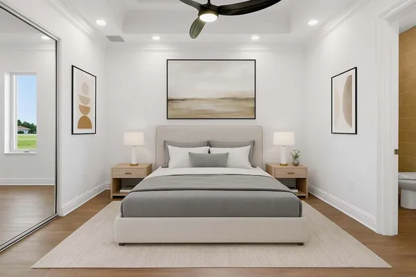 a bedroom with a large bed and a painting on the wall