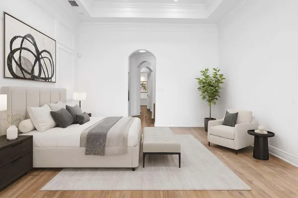 a bedroom with bed and a couch