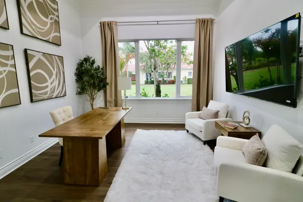 a living room with furniture and a large window
