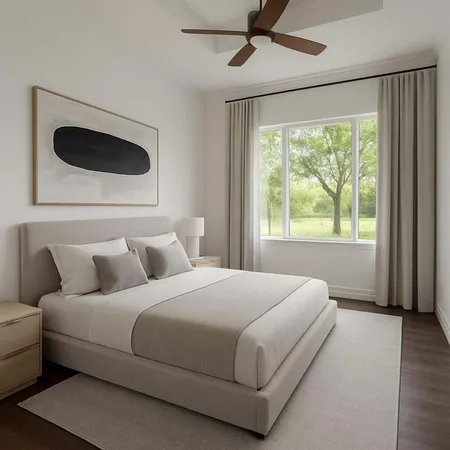 a bedroom with a bed and a large window