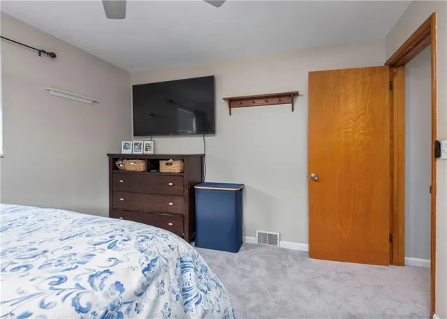 a living room with furniture and a lamp