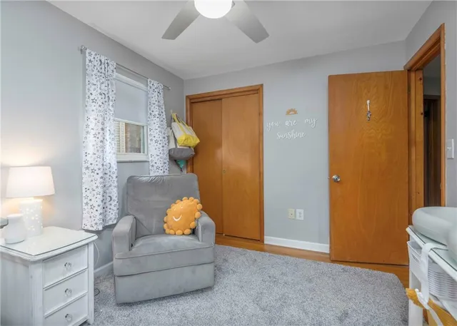 a bed room with a bed and a chair