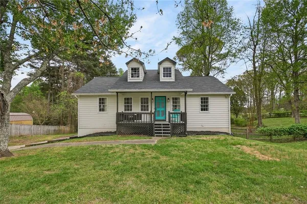 front view of a house with a yard