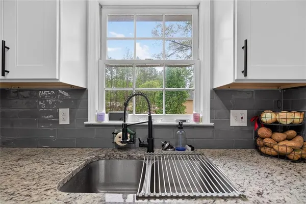 a kitchen with a sink and a window