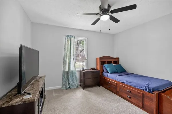 a room with furniture and a flat screen tv